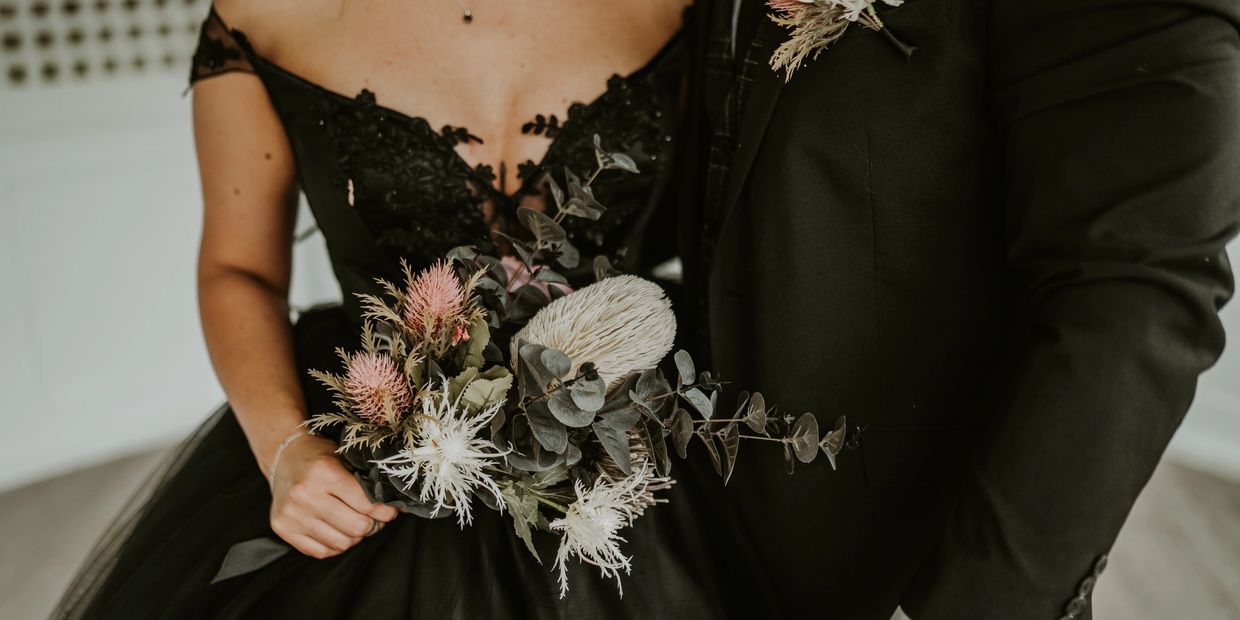 Hannah Black on her wedding day with bouquet.