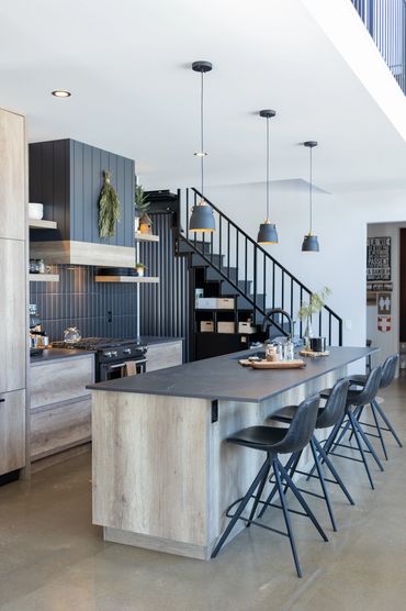 Modern kitchen with oak cabinets and black accents