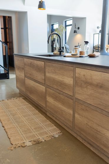 Oak kitchen island with multiple push to open cabinet doors