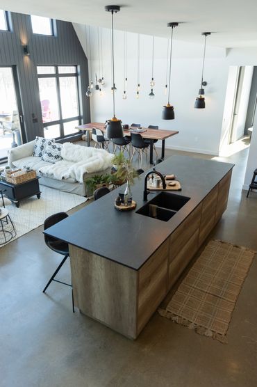 Over head view of kitchen island with black countertop and oak cabinets