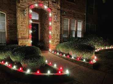 Christmas Light Install Red White Candy Cane Theme