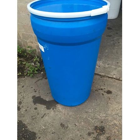 Tall blue plastic drum on concrete ground.