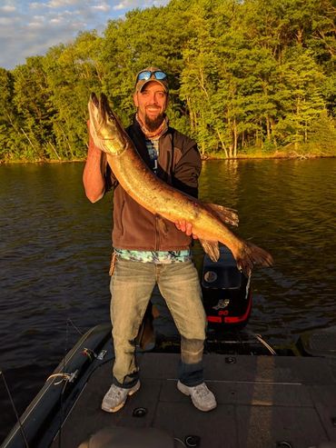 Fishermen holding a 42-inch musky on the Chippewa Flowage 