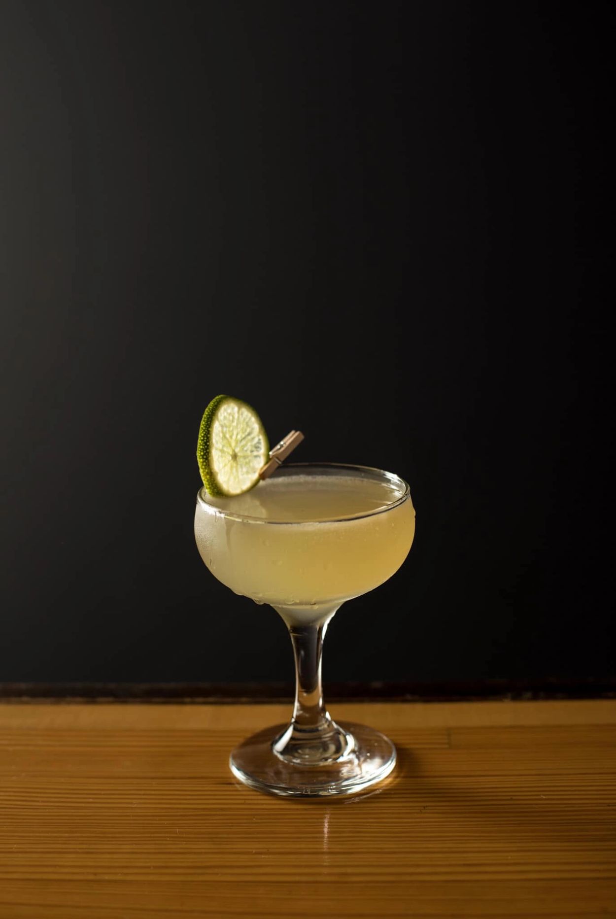 A serene landscape featuring mountains, a lake, and a vibrant sunset sky.