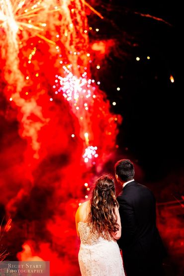 Bride and groom enjoying fireworks. Photo by Right Start Photography, @rightstartstudios 