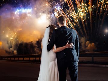 Bride and groom watching fireworks