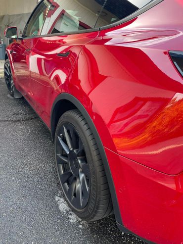 Tesla that was washed and decontaminated from dirt and debris to provide a high gloss shine.