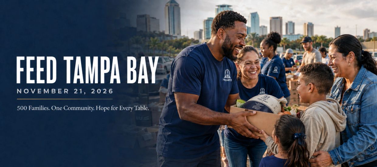 Volunteers distributing food to families in Tampa Bay event.