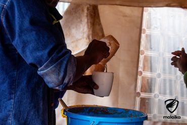 February 24th Action - porridge being poured by volunteers