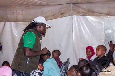 February 24th Action - Robert speaking with children during life skills session