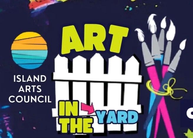 Art in the yard with paintbrushes and a fence.