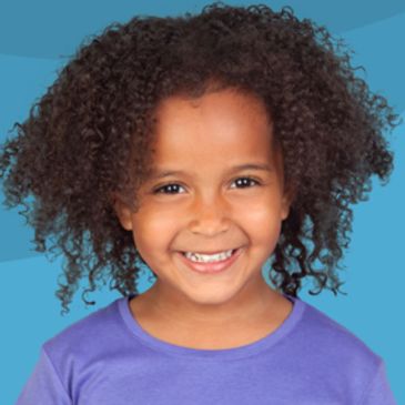 Smiling girl with curly hair