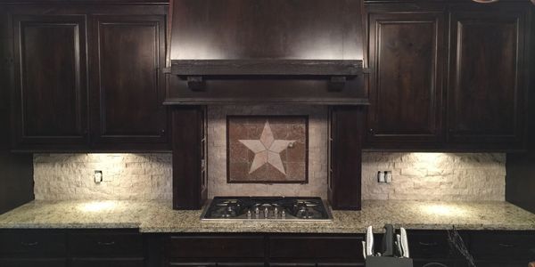 Natural stone makes a beautiful backsplash. The "Texas Star" is a popular choice for Brazoria County