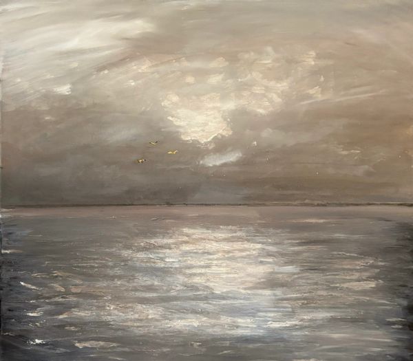 A serene seascape with a cloudy sky and birds flying above calm waters.