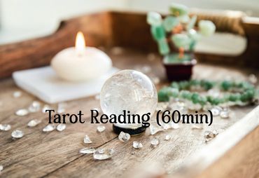 quartz crystal ball with candle and other healing stones