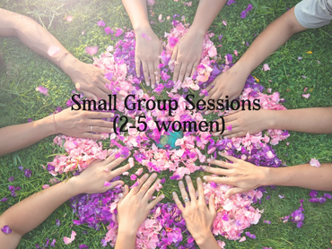 women's hands touching two circles of flower petals
