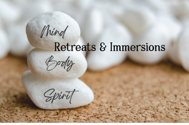 three rocks stacked on top of one another that say "mind," "body," "spirit"