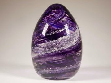 Cremation Ashes set inside handmade crystal Oval Paperweight.