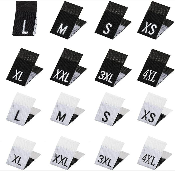 Black and white clothing size labels from XS to 4XL.
