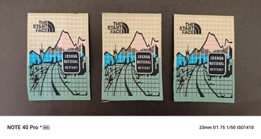 Three identical patches with a mountain design and text 'THE START FACE' and 'JOSHUA NATIONAL NEXTEXIT'.