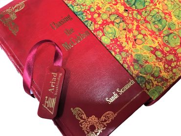 Luxury leather-bound book with gold foil stamping and vibrant marbled endpapers in Australia.