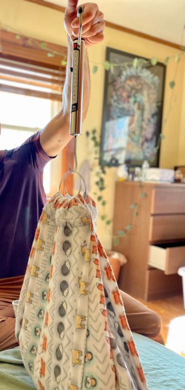 Weighing baby in a sling after a home birth