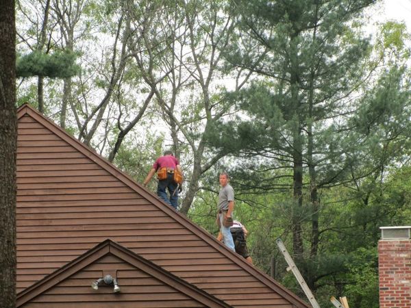 Another Project by Robert Kierce Contracting, Inc.
Brown house with workers