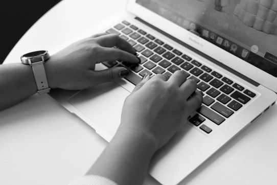Person typing on laptop