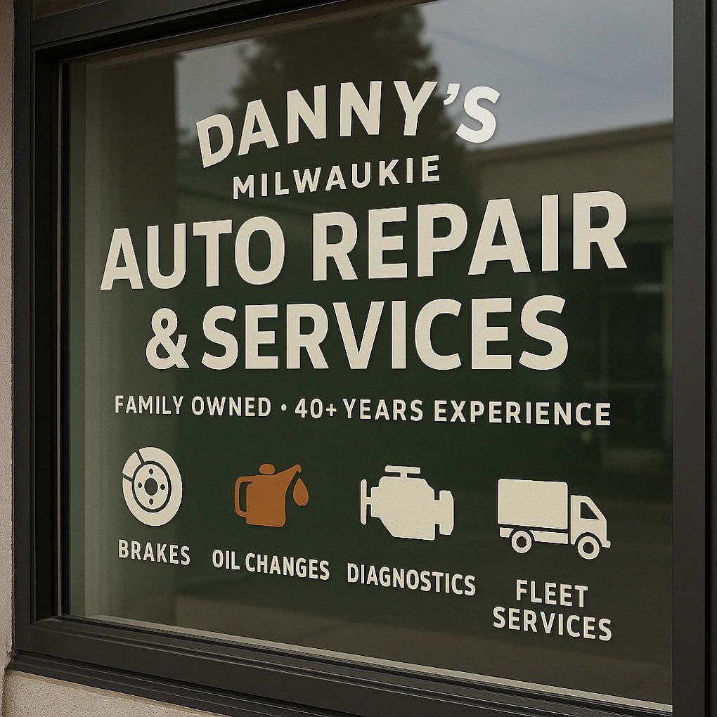 Window sign for Danny's Milwaukie Auto Repair with services listed.