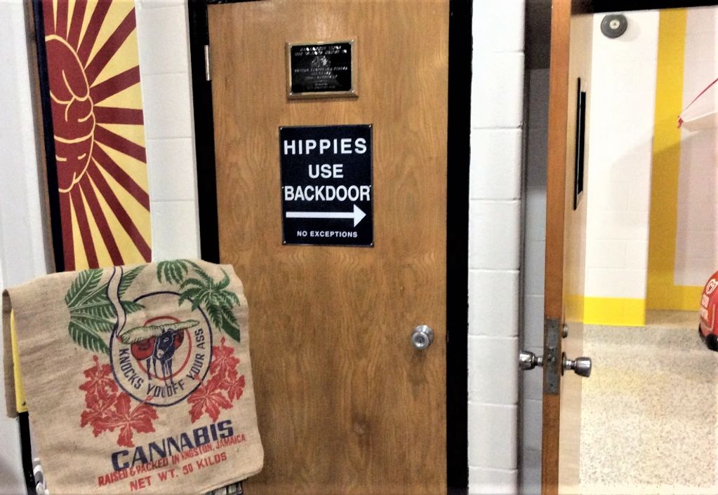 Sign for Hippies to use backdoor