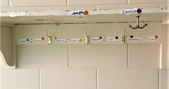 old shelf and coat hooks in schoolhouse