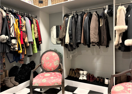 coats hanging in coat closet