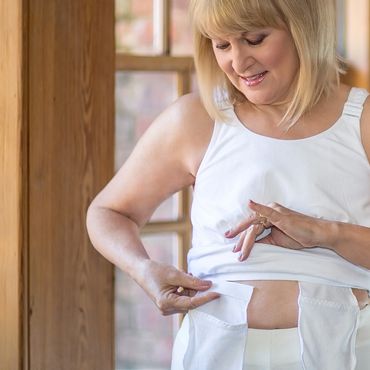 Post surgical tank tops with built in pockets for drain tubes.