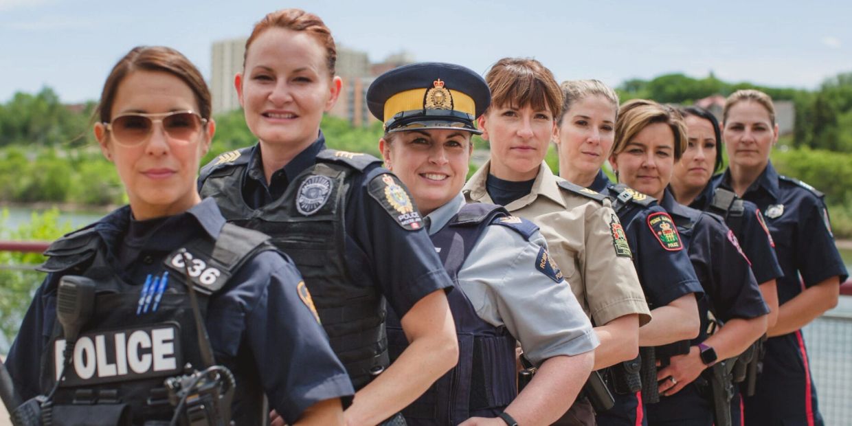 Group of female police officers in uniform.