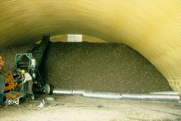 Interior of yellow arched storage building