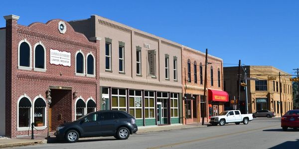 City of Alvin, TX in downtown, building with cars in the parking lots