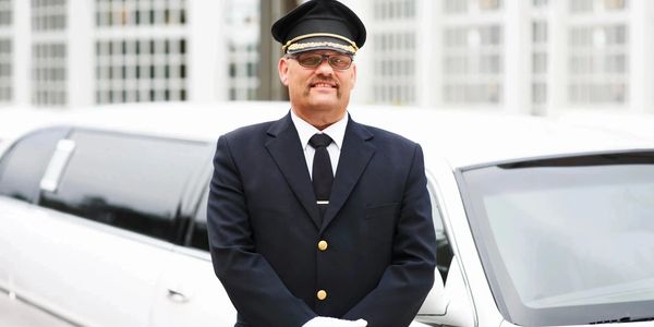 Houston Limousine Service - Friendly Chauffeur Assisting Passengers
