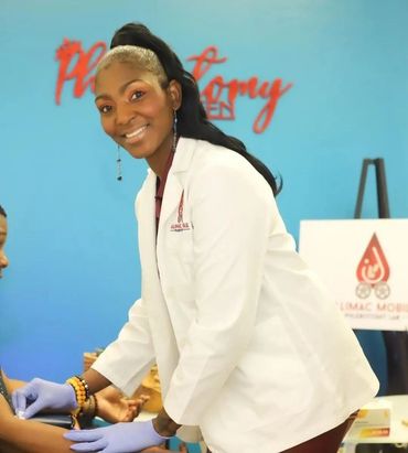 Camilla Henderson preparing to extract blood from a patient