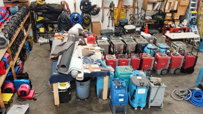 Warehouse with various equipment and tools organized.