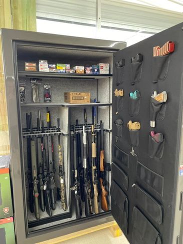 liberty safe filled with guns and ammo