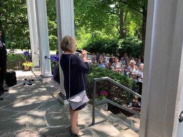 Rhonda Miller, Executive Director, greeting the crowd of supporters