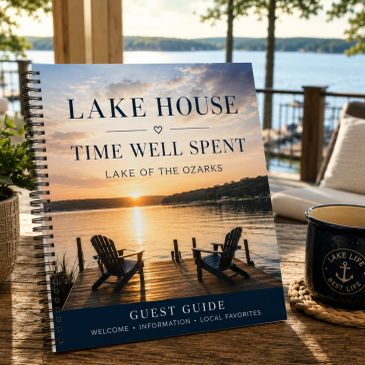 A cozy lake house guest guide on a wooden table by the water.