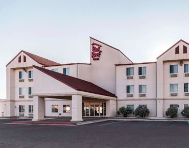 Exterior of a Red Roof Inn hotel.
