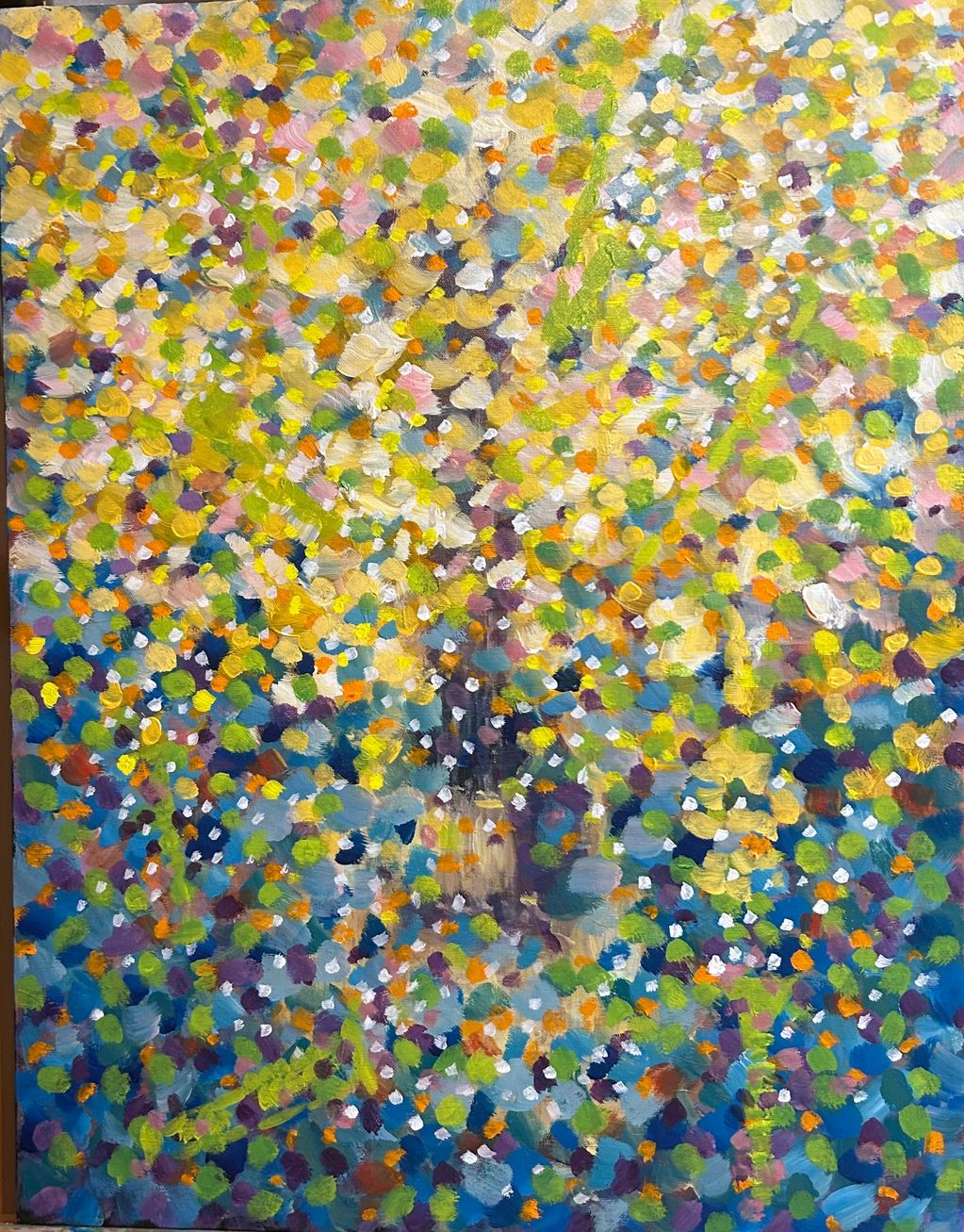 Colorful impressionist painting of a tree in full bloom with vibrant dots of paint.