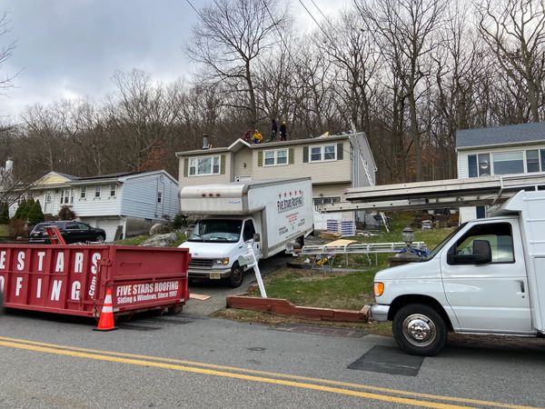 Residential roofing installation vehicles on the display