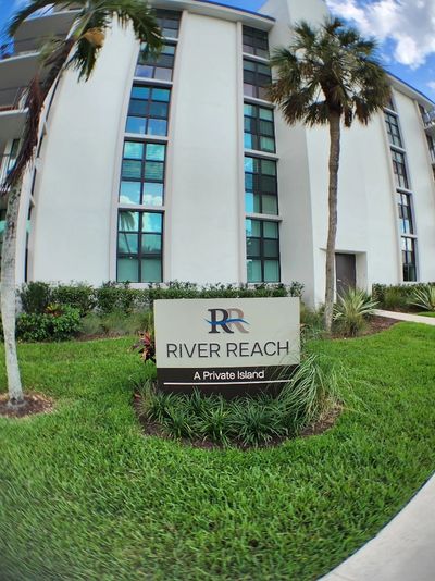 Sign of River Reach private island in front of a building.