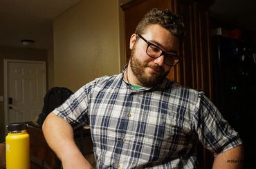 Man looking to right in stark light