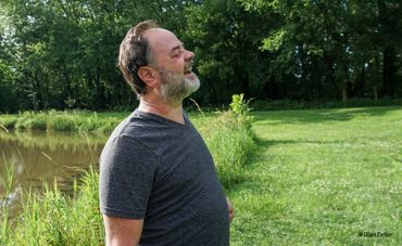 Man in profile laughing