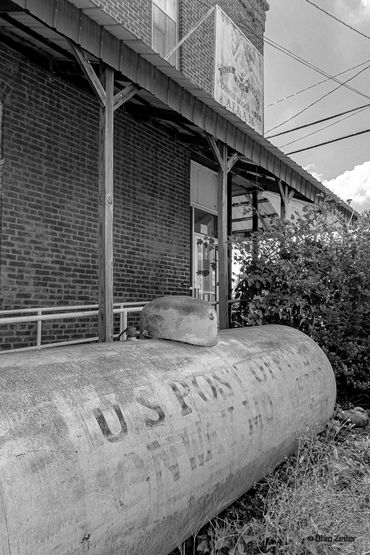 USPS gas tank in front of building