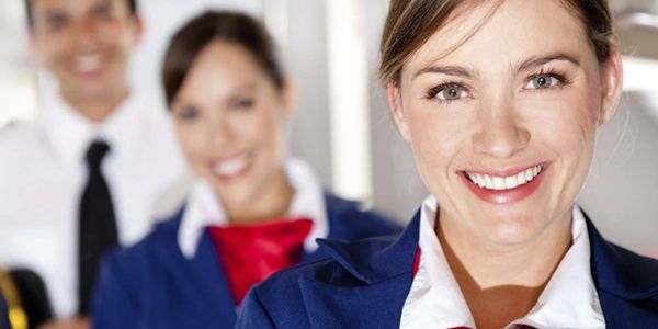 Radiant smiles from happy cruise line staff, cruise liners